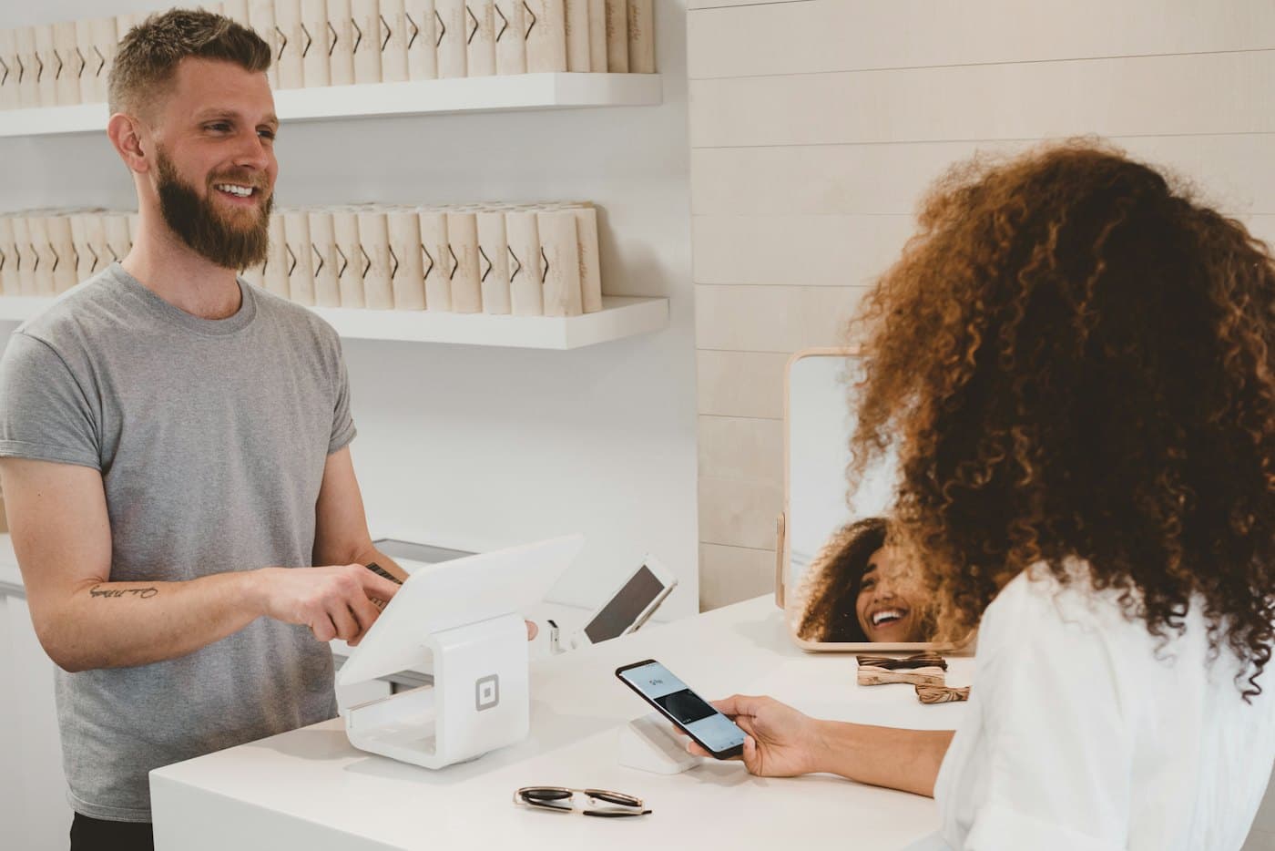 Online store owner packing orders for shipment